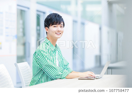 college student using computer 107758477