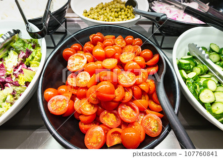 Cut vegetable tomatoes from a large cruise ship restaurant Cut vegetable tomatoes from a large cruise ship restaurant 107760841