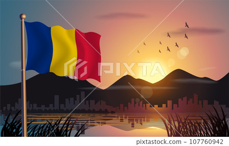 Chad flags flutter against the sunrise sky and beautiful lake. Celebrating national day and travel tourism 107760942
