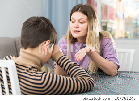 Offended boy and angry mother having quarrel at home Offended boy and angry mother having quarrel at home 107761243