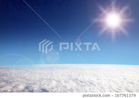 Sunlight and clouds from an airplane Sunlight and clouds from an airplane 107761379