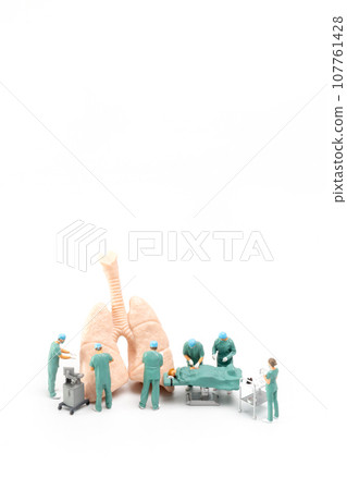 Miniature Doctor and nurse medical team are performing surgical operation at emergency room 107761428