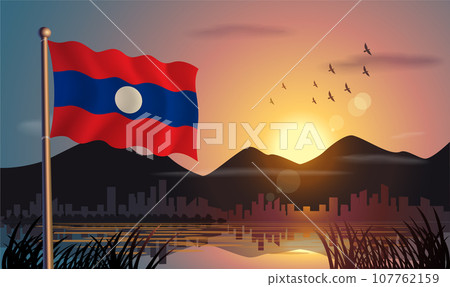 Laos flags flutter against the sunrise sky and beautiful lake. Celebrating national day and travel tourism 107762159