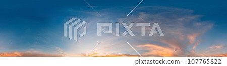 Sunset sky panorama with bright glowing pink Cirrus clouds. HDR 360 seamless spherical panorama. Full zenith or sky dome for 3D visualization, sky replacement for aerial drone panoramas. 107765822