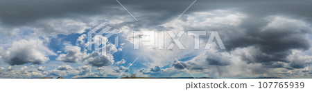 Sky panorama at noon with cumulus clouds in a seamless spherical equiangular format as a full zenith for use in 3D graphics, game play, and in aerial drone 360-degree panoramas to replace the sky. Sky panorama at noon with cumulus clouds in a seamless spherical equiangular format as a full zenith for use in 3D graphics, game play, and in aerial drone 360-degree panoramas to replace the sky. 107765939