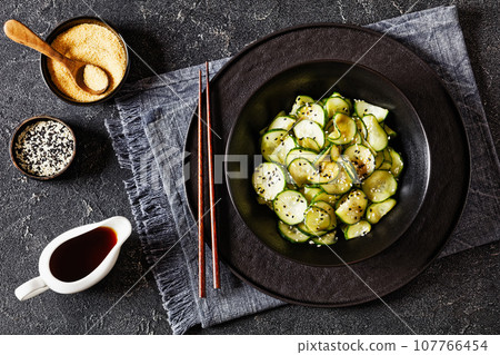 Sunomono, Japanese Cucumber Salad in a black bowl 107766454