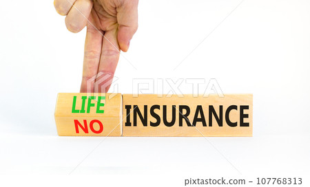 Life or no insurance symbol. Concept words Life insurance No insurance on wooden blocks. Beautiful white background. Businessman hand. Business Life or no insurance concept. Copy space. 107768313