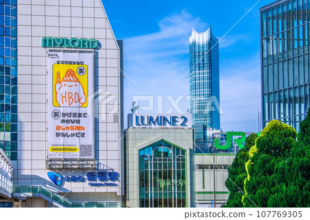 Tokyo cityscape in Japan in October, overlooking Odakyu Shinjuku Station. Busta Shinjuku on glass. On the right is JR Shinjuku Station South Exit = 13th Tokyo cityscape in Japan in October, overlooking Odakyu Shinjuku Station. Busta Shinjuku on glass. On the right is JR Shinjuku Station South Exit = 13th 107769305