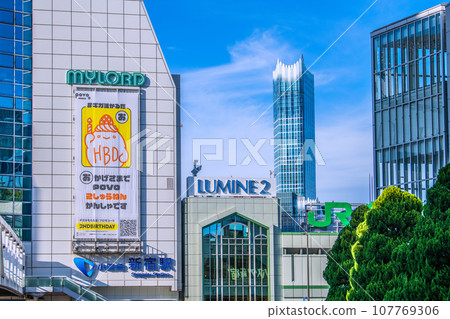 Tokyo cityscape in Japan in October, overlooking Odakyu Shinjuku Station. Busta Shinjuku on glass. On the right is JR Shinjuku Station South Exit = 13th Tokyo cityscape in Japan in October, overlooking Odakyu Shinjuku Station. Busta Shinjuku on glass. On the right is JR Shinjuku Station South Exit = 13th 107769306