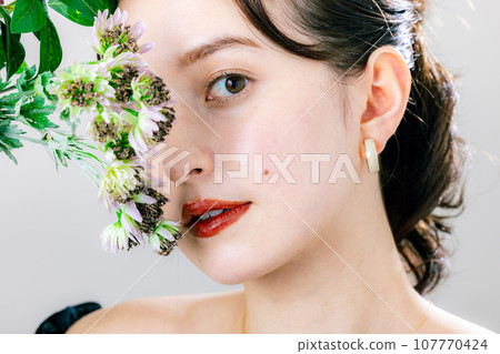 Woman with a bouquet Woman with a bouquet 107770424