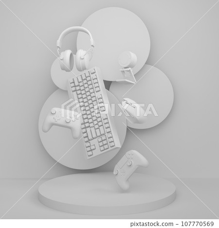 Set of video game joystick, keyboard and headphones on monochrome podium 107770569