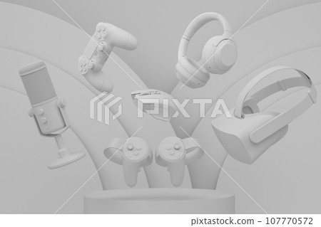 Set of video game joystick, microphone and headphones on monochrome podium 107770572