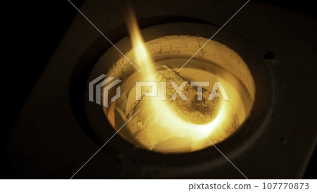 Iron lingot on 1000 C temperature in furnace. Inside a furnace 107770873