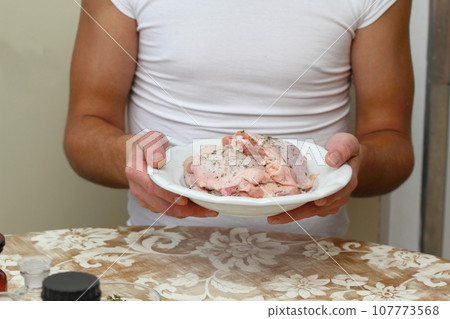 Man's hands and raw chicken meat Man's hands and raw chicken meat 107773568