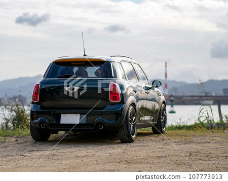 Mini crossover parked on the beach Mini crossover parked on the beach 107773913