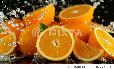 Pile of Oranges with Splashing Water Around. Pile of Oranges with Splashing Water Around. 107776004