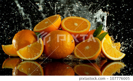 Pile of Oranges with Splashing Water Around. Pile of Oranges with Splashing Water Around. 107776005