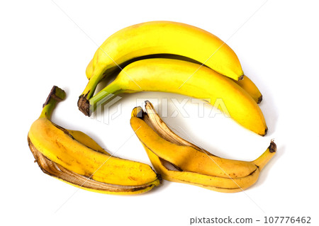 Bananas and banana peels on a white background. Bananas and banana peels on a white background. 107776462