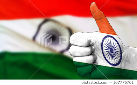 thumbs up in approval with the Indian flag painted 107776701