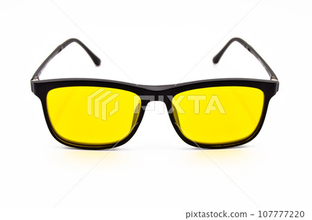 Black plastic frame yellow lens glasses, glasses isolated on white background Black plastic frame yellow lens glasses, glasses isolated on white background 107777220