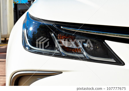 Detail of car headlights lamp, white modern car front lamp Detail of car headlights lamp, white modern car front lamp 107777675