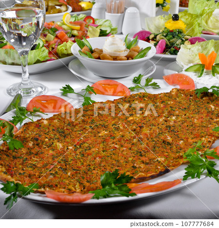 Turkish lahmacun kebap, one of the most important dishes of Turkish cuisine 107777684