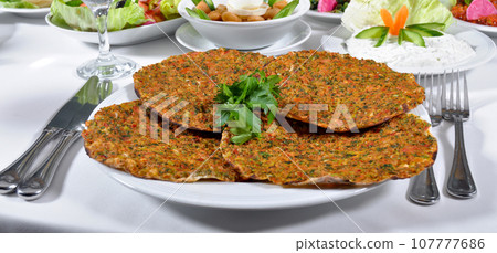 Turkish lahmacun kebap, one of the most important dishes of Turkish cuisine 107777686