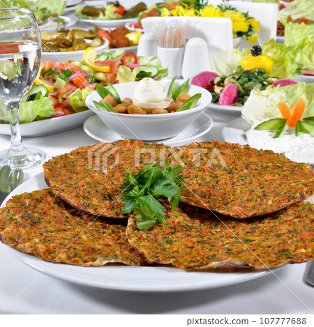 Turkish lahmacun kebap, one of the most important dishes of Turkish cuisine 107777688