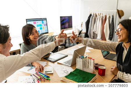 people working in creative workplaces 107779803