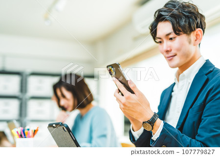 people working in creative workplaces people working in creative workplaces 107779827