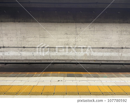Braille blocks on the platform of a subway station without trains Braille blocks on the platform of a subway station without trains 107780592