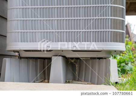 Selective focus on an air conditioner pad to level and hold the unit off the ground. Selective focus on an air conditioner pad to level and hold the unit off the ground. 107780661