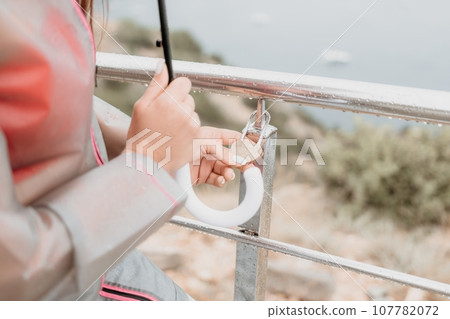 Wedding heart golden lock on stainless iron fence valentines day symbol of eternal love a wedding Wedding heart golden lock on stainless iron fence valentines day symbol of eternal love a wedding 107782072