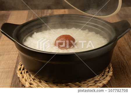 Rice porridge, pickled plums 107782708