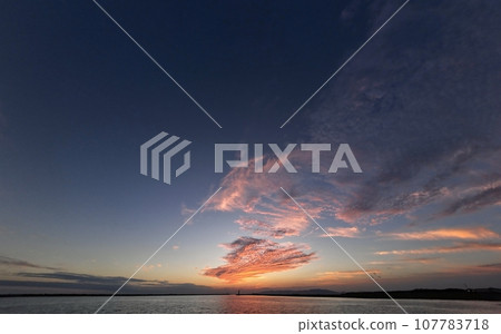 Port with a colorful sunset with various clouds, Autumn, Ultra wide angle, Sky-based, 231004pm 107783718