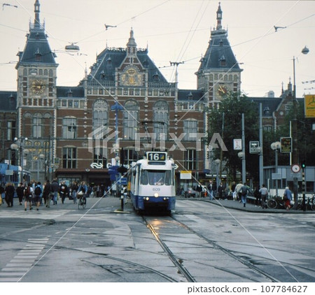 Tram in front of Amsterdam Central Station, Amsterdam, Netherlands 107784627