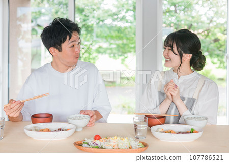 Couple complimenting wife after eating at home (delicious/self-cooked) Couple complimenting wife after eating at home (delicious/self-cooked) 107786521