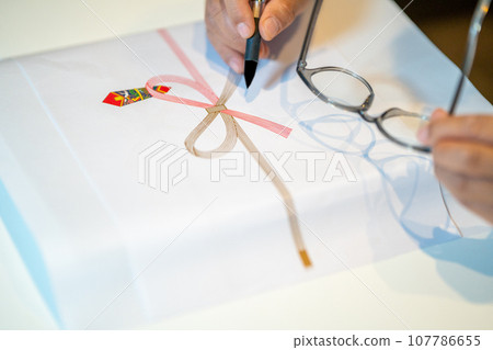 Prepare a brush pen and reading glasses and write Prepare a brush pen and reading glasses and write 107786655