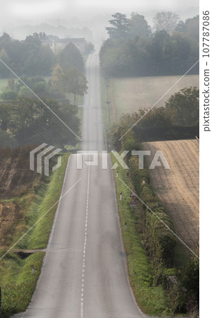 a long strip of asphalt a long strip of asphalt 107787086