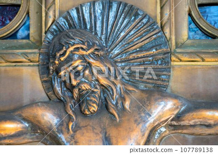 Profile of bronze Jesus on cross radiant halo crucifix resurrection Profile of bronze Jesus on cross radiant halo crucifix resurrection 107789138