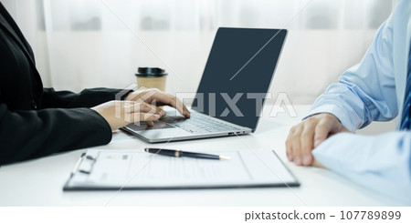 Business people hold a resume and talk to job applicants for job interviews about careers and Their personal history in the company. Recruitment concepts Business people hold a resume and talk to job applicants for job interviews about careers and Their personal history in the company. Recruitment concepts 107789899