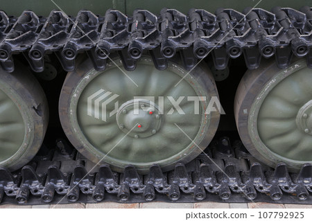 close up of old military tank wheel on caterpillar tracks. 107792925
