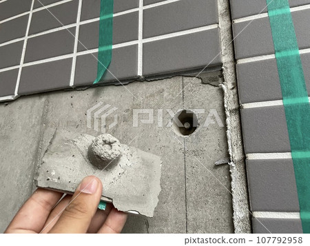 Tiles that do not adhere well due to the release agent used during construction 107792958