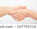 hands of people shaking hands 107793514