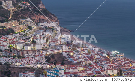 Aerial view of the coastline of the village of Sesimbra day to night timelapse. Portugal 107793870