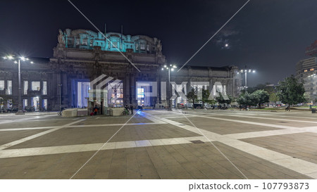 Panorama showing Milano Centrale night timelapse - the main central railway station of the city of Milan in Italy. 107793873