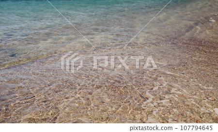 clear sea water on a beach closeup clear sea water on a beach closeup 107794645