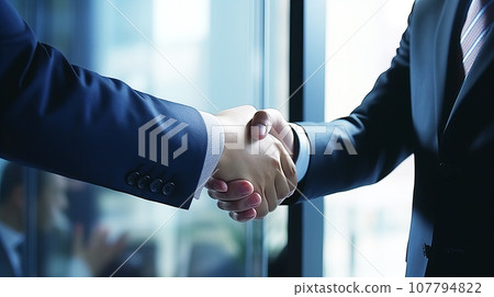 Two businessmen shaking hands Two businessmen shaking hands 107794822
