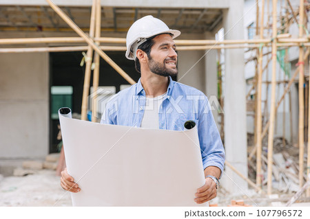 Construction engineer builder work in construction site. Architect home project foreman chief designer happy with floor plan. Construction engineer builder work in construction site. Architect home project foreman chief designer happy with floor plan. 107796572