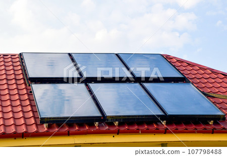Six solar panels on the roof of the house 107798488